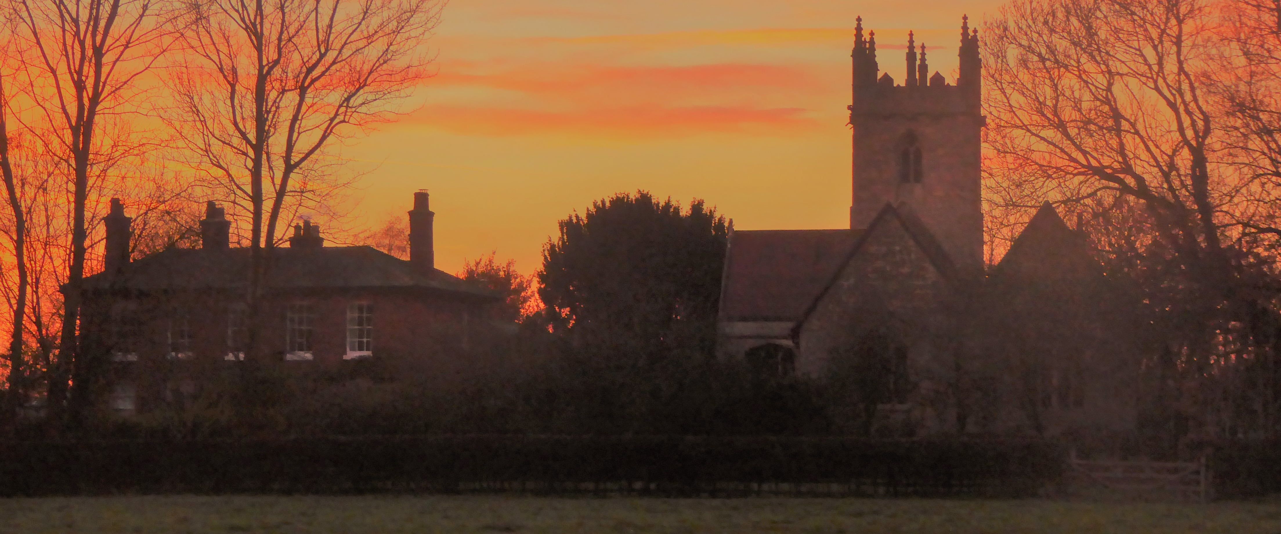 Photo of st peter's church norton disney at sunset